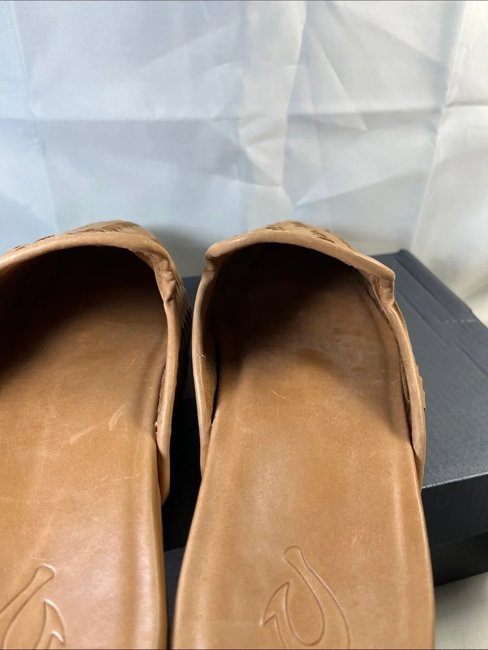 OluKai women’s Tan Woven Leather Slip-On Loafers
